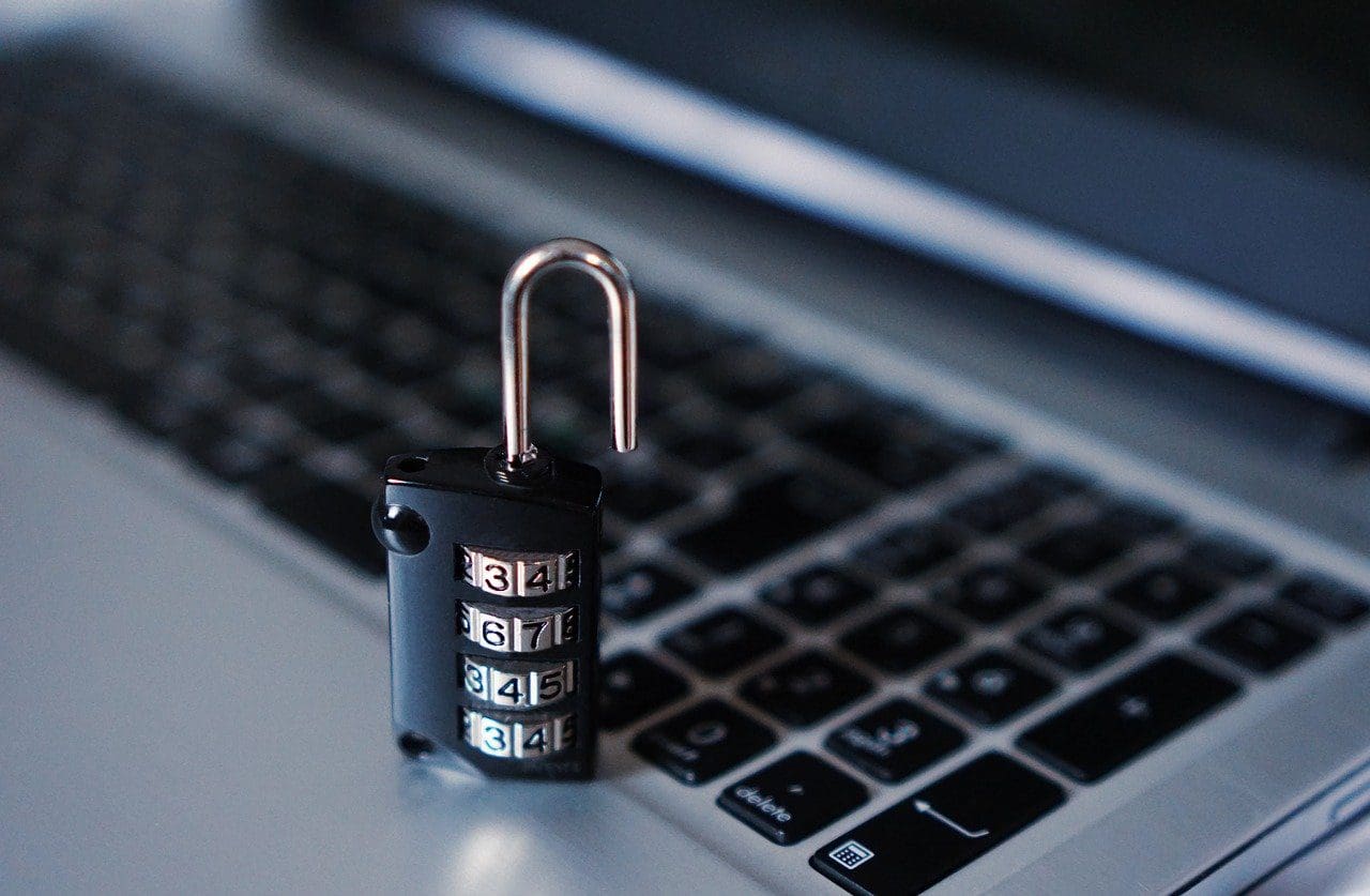 lock sitting on a laptop imitating online security